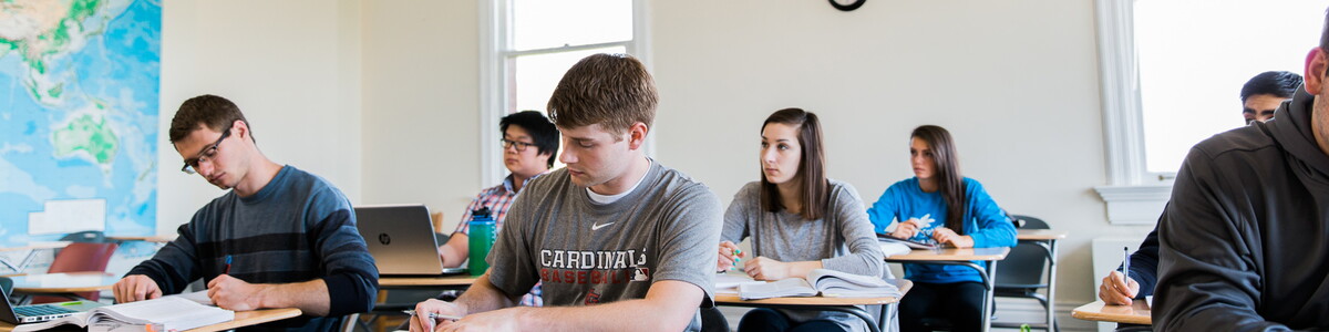 Classroom in Old Main with several students at their desks.